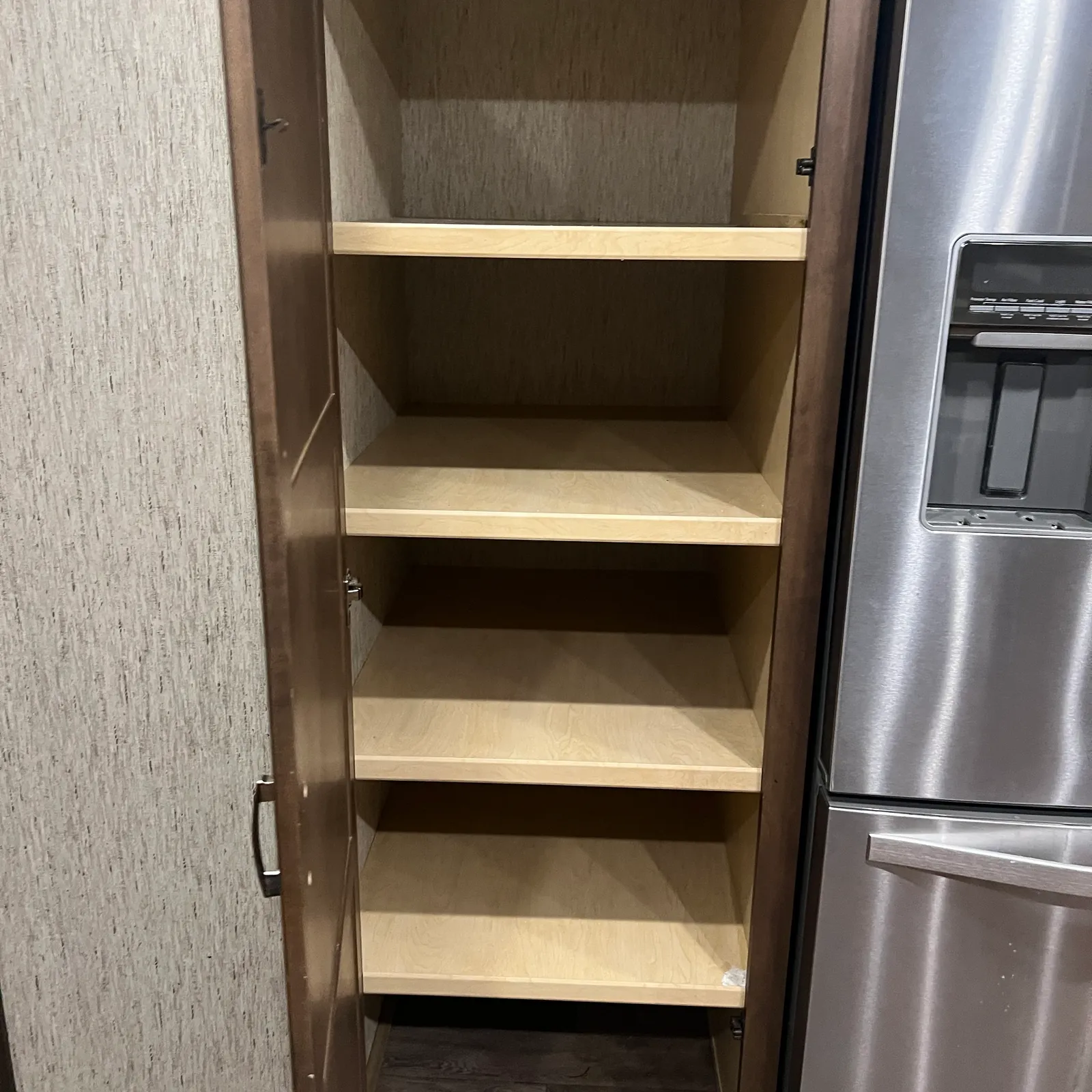 2019 Newmar Ventana 4045 Class A Diesel Pusher motorhome, open storage cabinet with wooden shelves in galley area