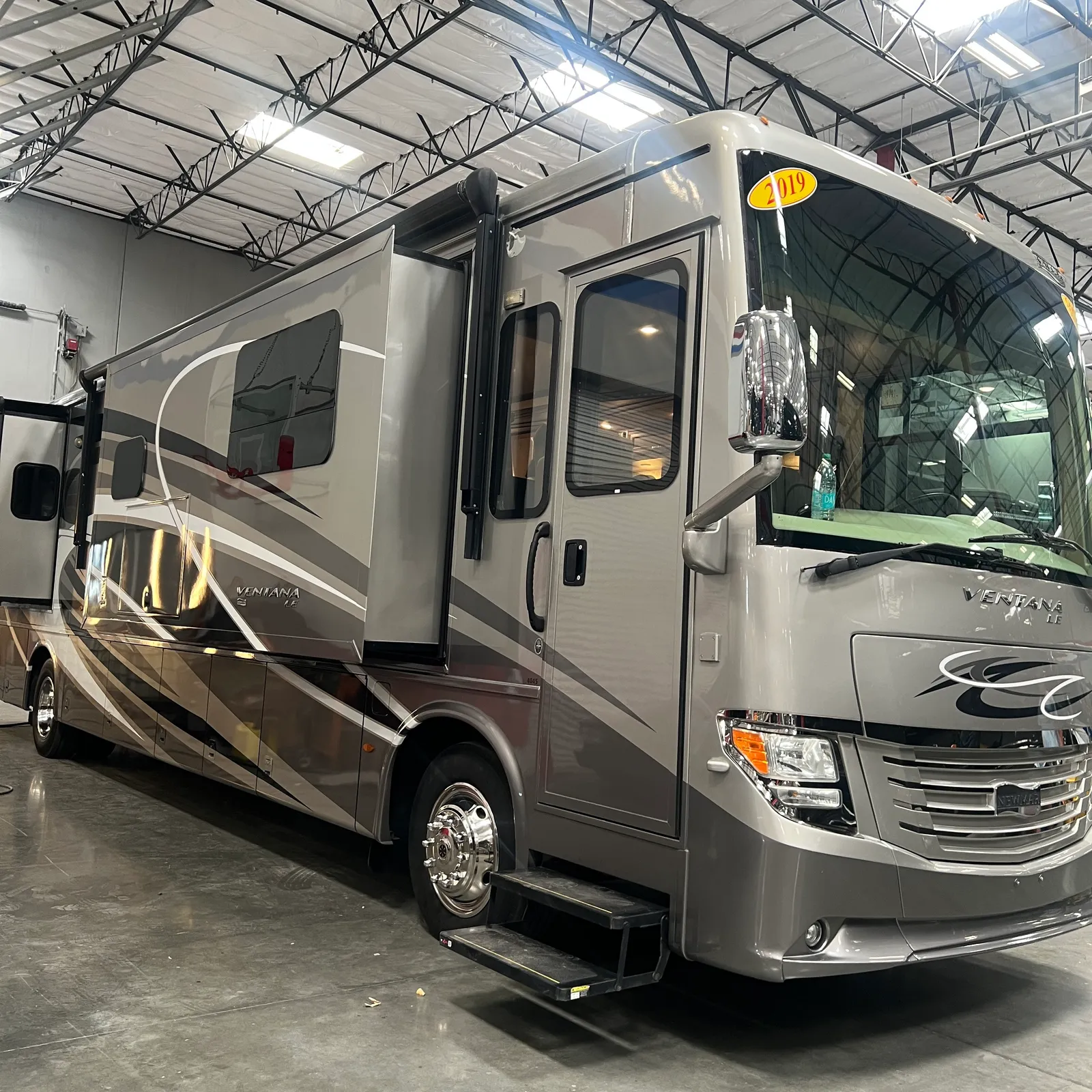 2019 Newmar Ventana 4045 Class A Diesel Pusher motorhome, motorhome parked in warehouse showroom with entry door open