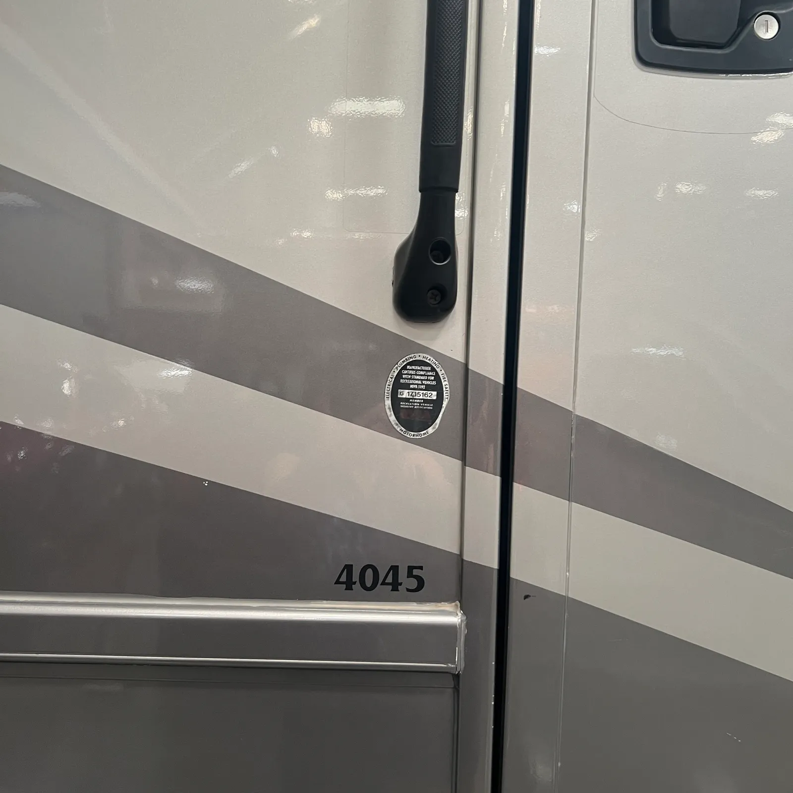 2019 Newmar Ventana 4045 Class A Diesel Pusher motorhome, motorhome side with two-tone paint and entry door handle