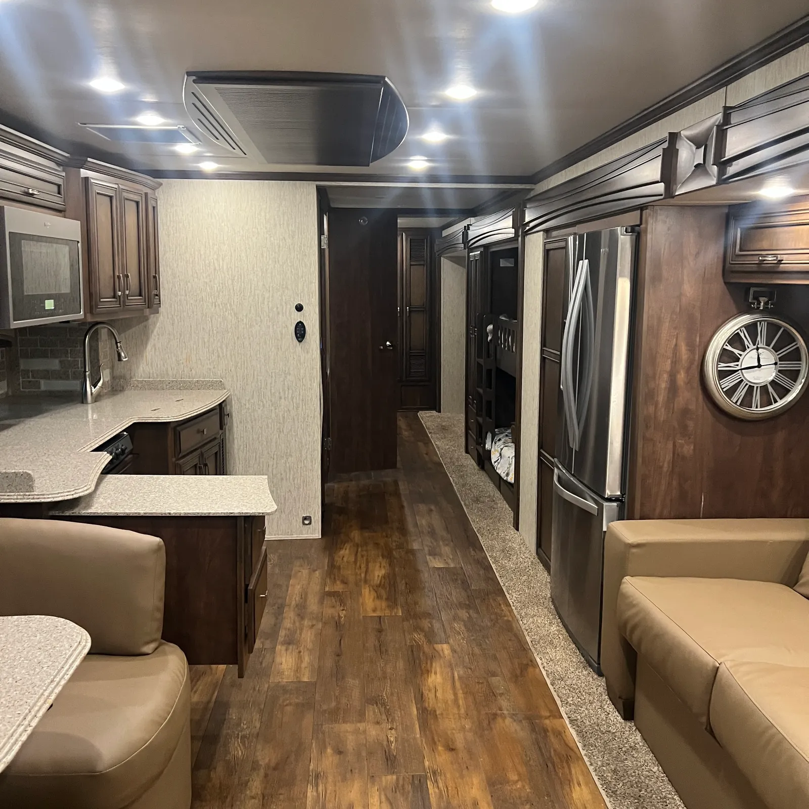 2019 Newmar Ventana 4045 Class A Diesel Pusher motorhome, galley and living area with kitchen, refrigerator, and seating