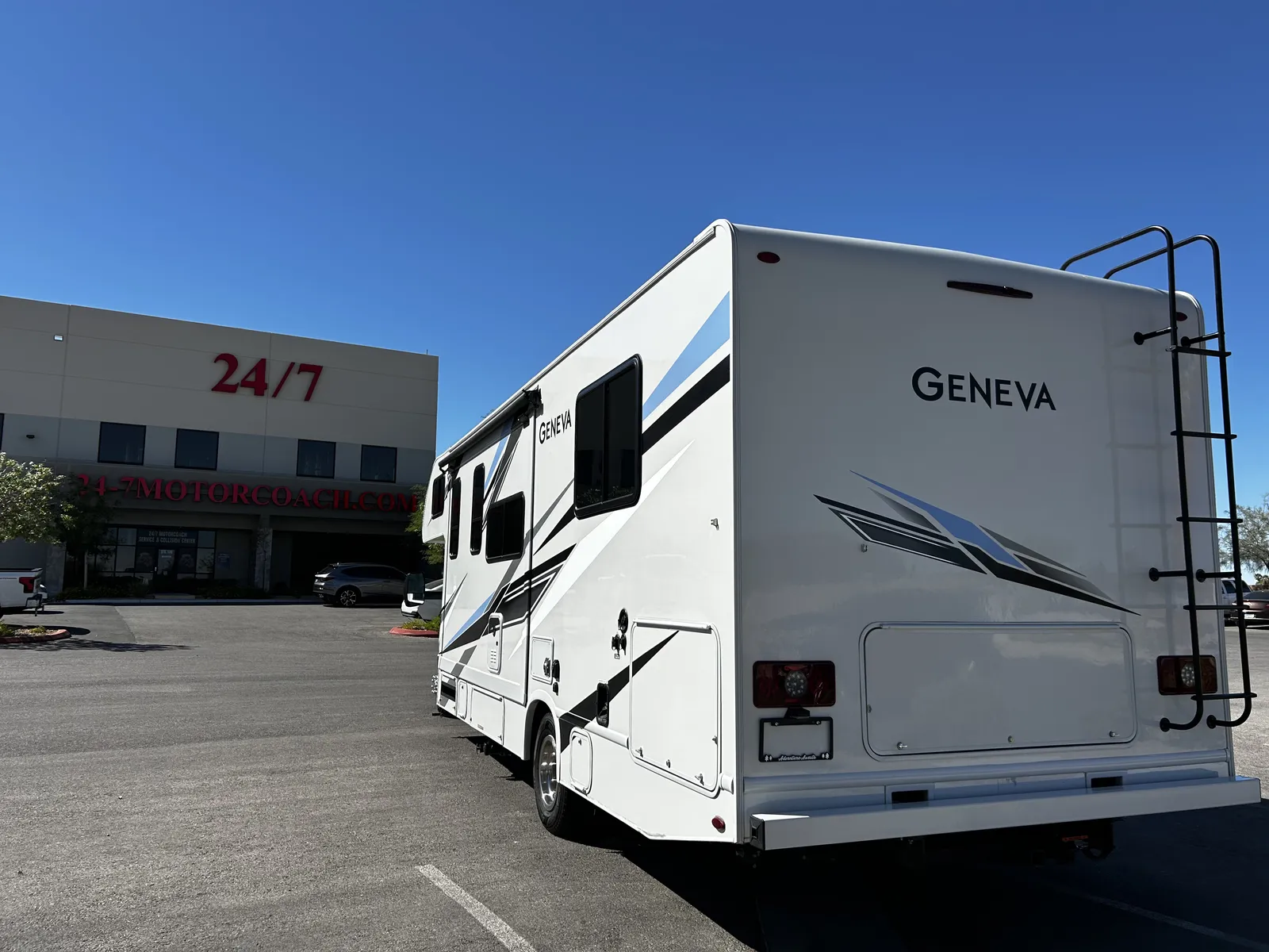 2023 Thor Motor Coach Geneva Class C motorhome, white motorhome with geneva branding parked at dealership lot