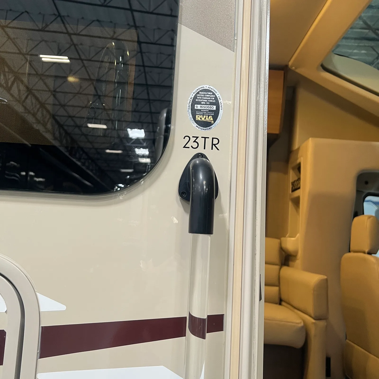 2018 Thor Motor Coach Compass 23TR Class C motorhome, motorhome exterior door and window detail showing model designation