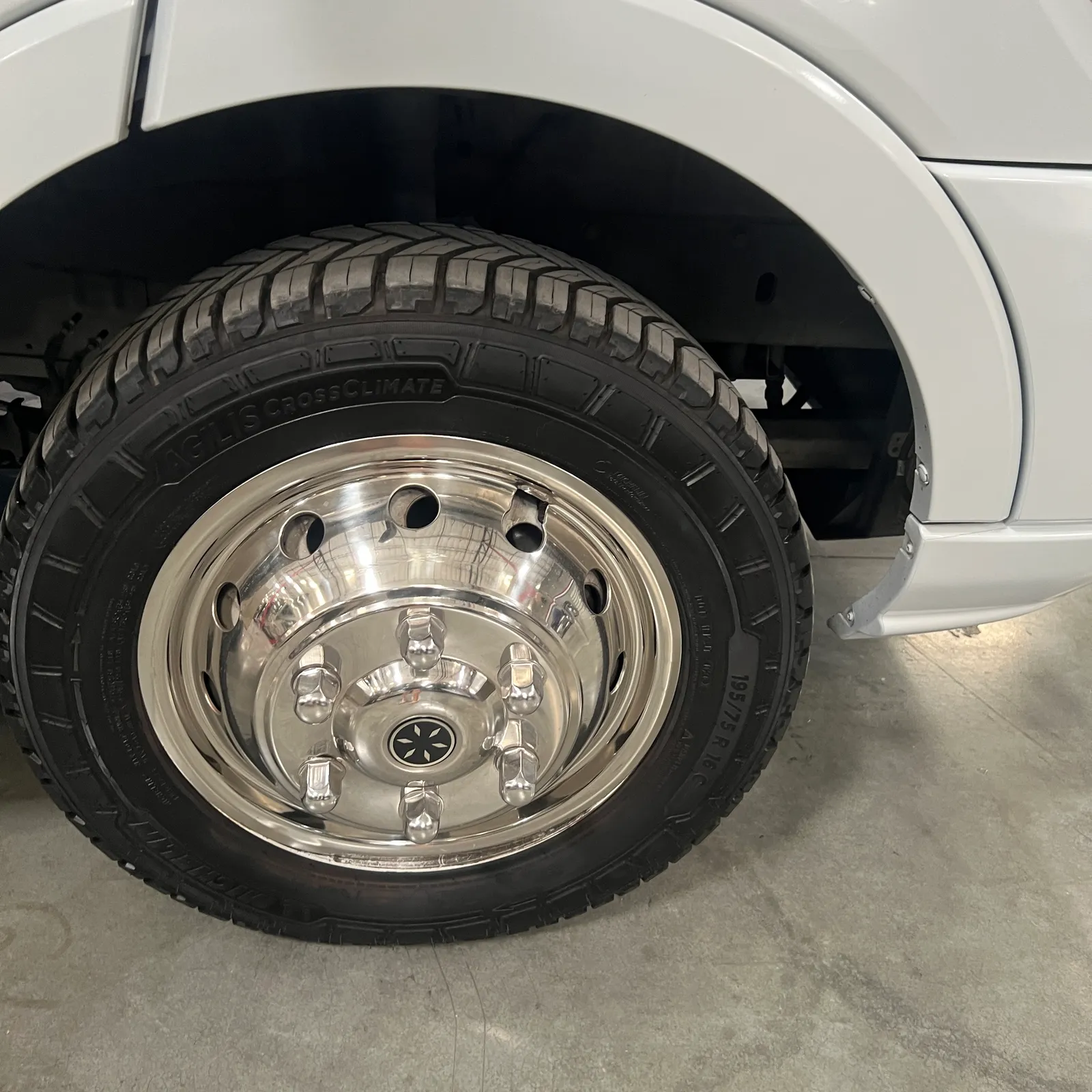 2018 Thor Motor Coach Compass 23TR Class C motorhome, polished chrome wheel with black tire on motorhome