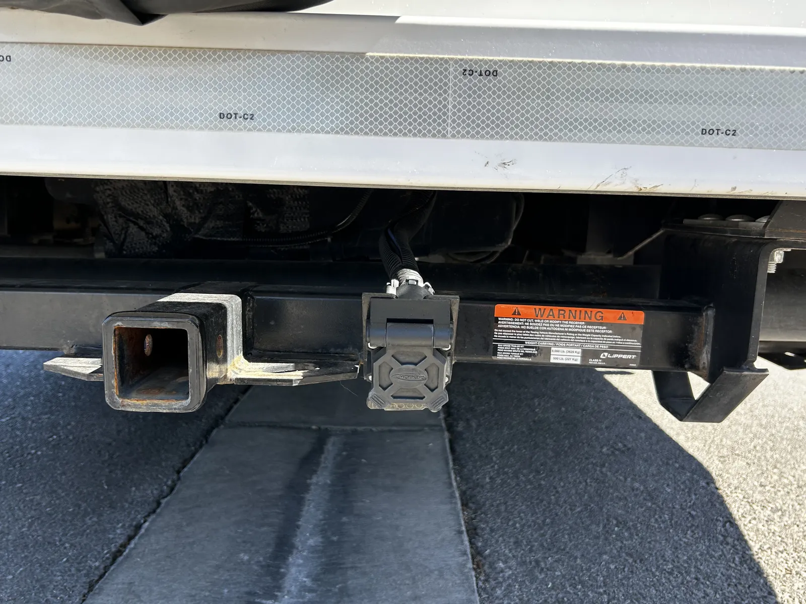 2023 Thor Motor Coach Four Winds Super C motorhome, rear bumper and hitch assembly with safety warning label
