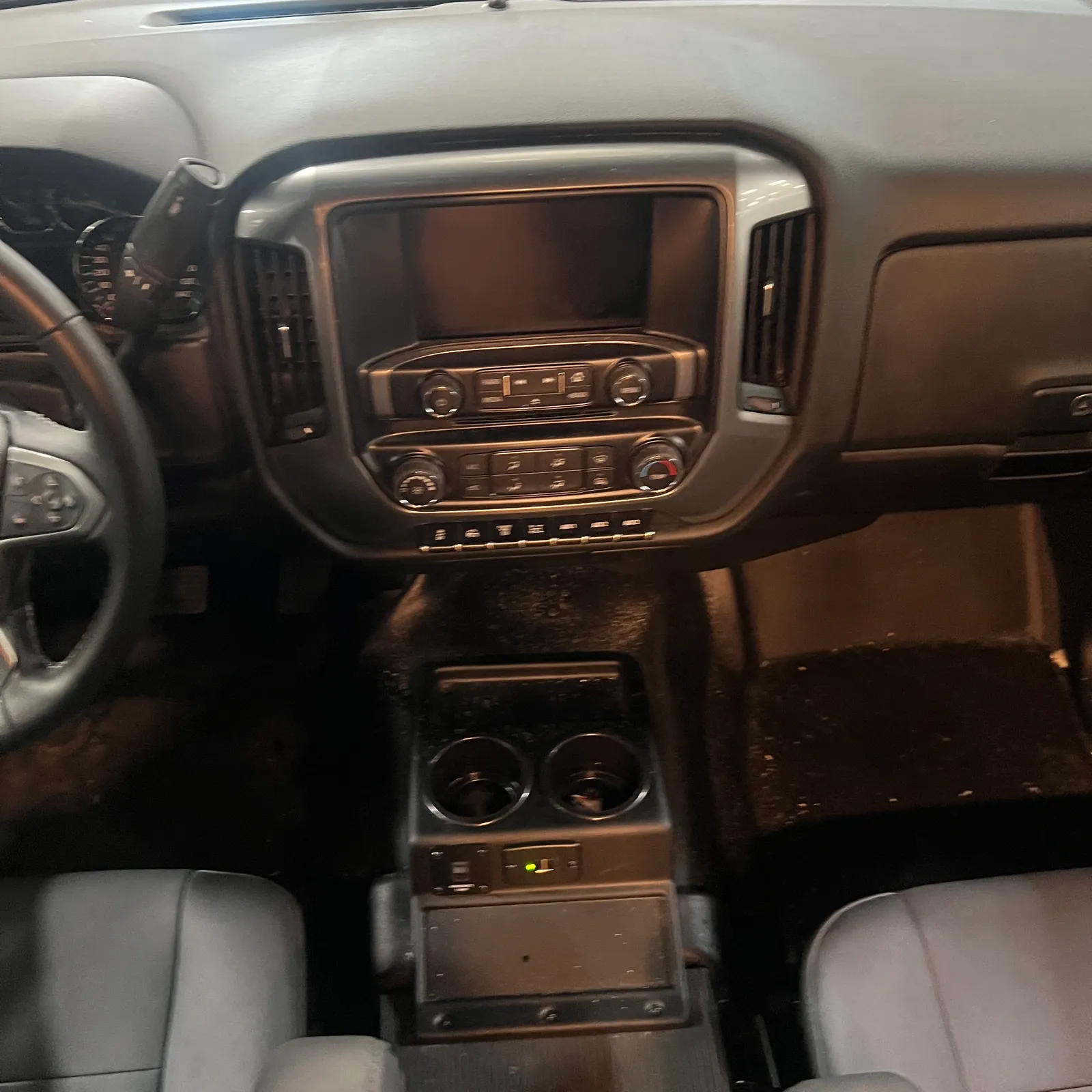 2027 Nexus Rebel AIR 34R Super C motorhome, driver's cabin with steering wheel, infotainment system, and climate controls