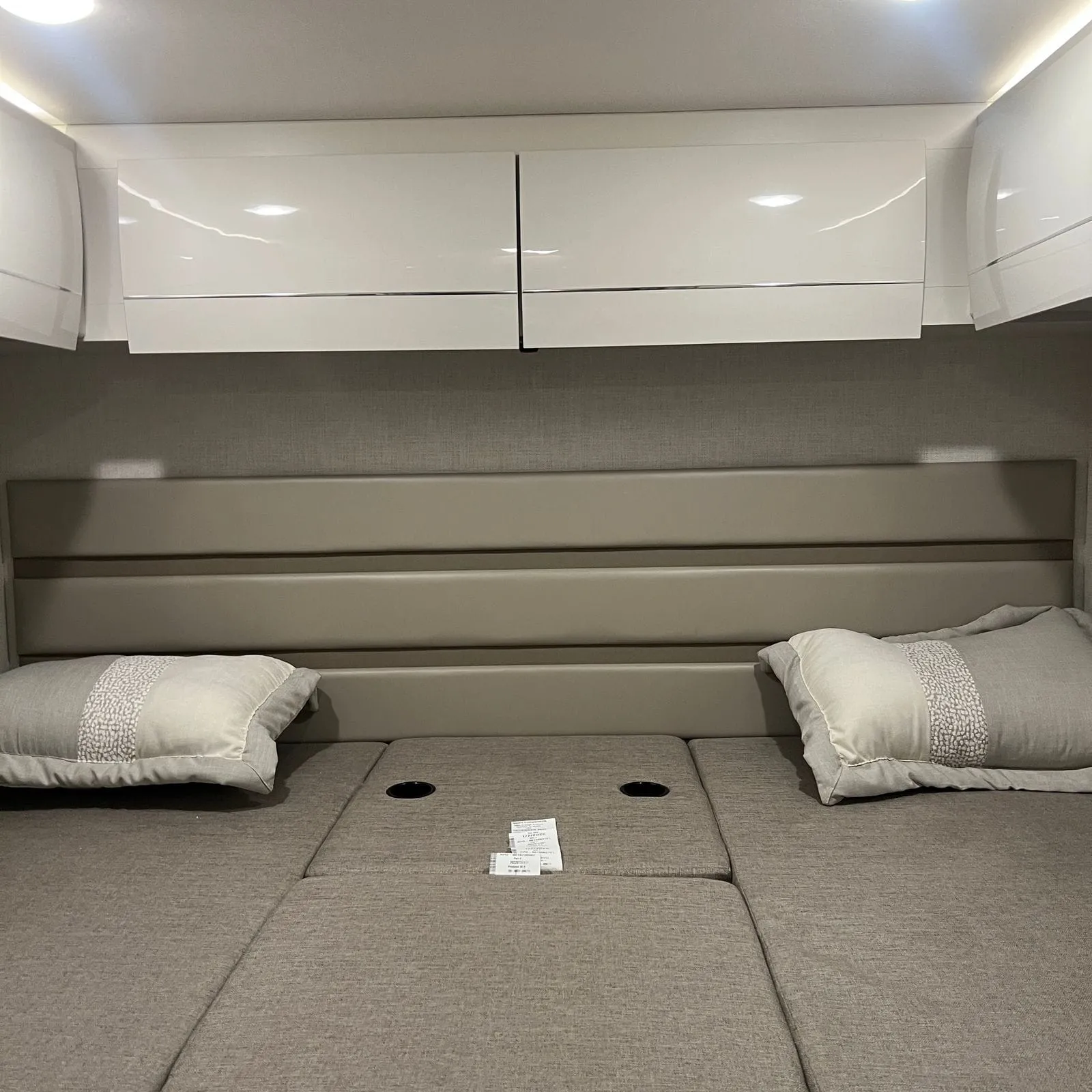 2026 Thor Delano 24XL Class C motorhome, bedroom with two twin beds and white overhead cabinets