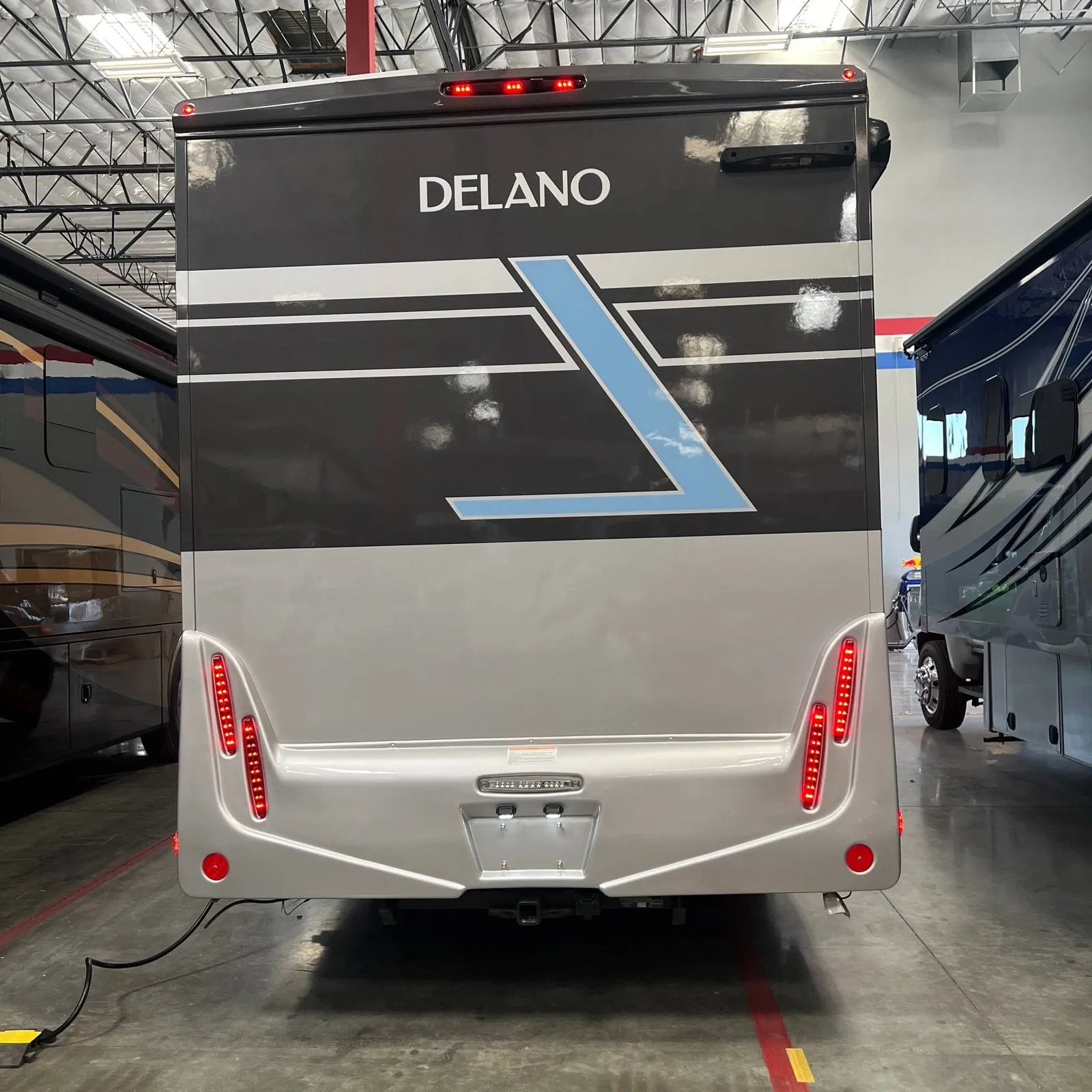 2026 Thor Delano 24XL Class C motorhome, rear view of motorhome with delano branding and red tail lights