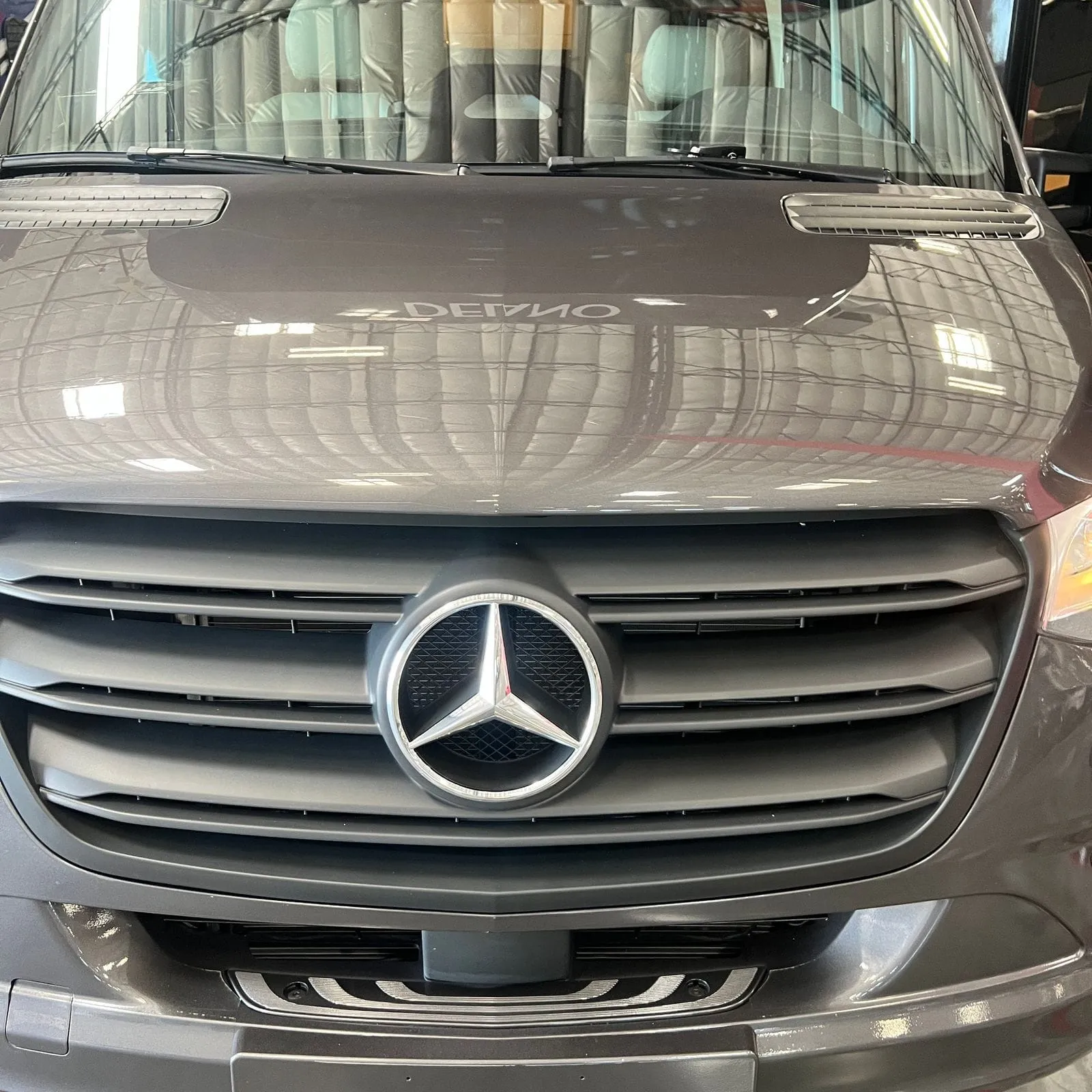 2026 Thor Delano 24XL Class C motorhome, motorhome front grille and windshield with chrome accents