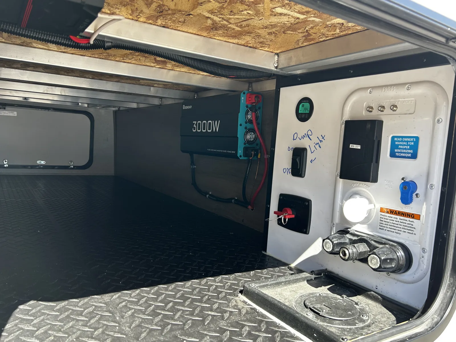 2024 Grand Design Imagine Xls 22MLE Travel Trailer motorhome, storage bay with generator, power inverter, and electrical control panel